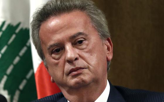 FILE - Riad Salameh the governor of Lebanon's Central Bank, listens to a journalist's question during a press conference, in Beirut, on Nov. 11, 2019. (AP Photo/Hussein Malla, File)