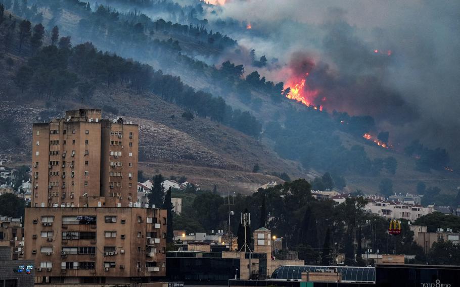 Smoke and fire covers the area following rocket attacks from Lebanon, amid ongoing cross-border hostilities between Hezbollah and Israeli forces, near Kiryat Shmona, Israel, close to its border with Lebanon, June 3, 2024. 