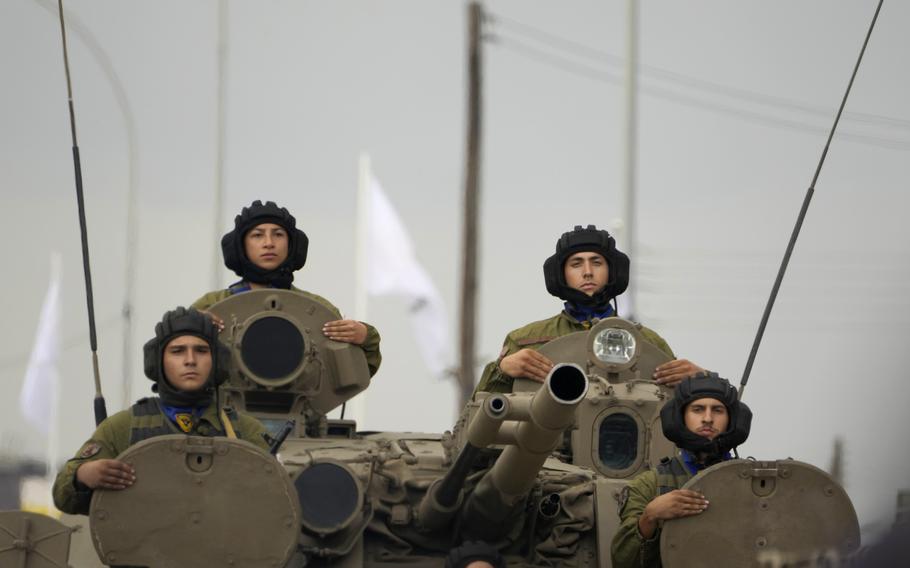 Cyprus’ soldiers on a military vehicle pass during a military parade marking the 63th anniversary of Cyprus’ independence from British colonial rule, in divided capital Nicosia, Cyprus, on Sunday, Oct. 1 2023.