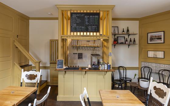 Inside the renovated Man Full of Trouble’s 25-seat tasting room. The tavern shines with authentic colonial gleam. Its owner, Dan Wheeler, worked with John Milner Architects, which specializes in historical renovations, to preserve the tavern’s historic credibility.