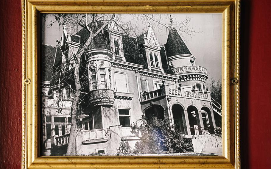 A photograph of the original Magic Castle mansion hangs in a common room in the castle on May 30 in Los Angeles. It first opened in 1963 as a private clubhouse for members of the Academy of Magical Arts and their guests.