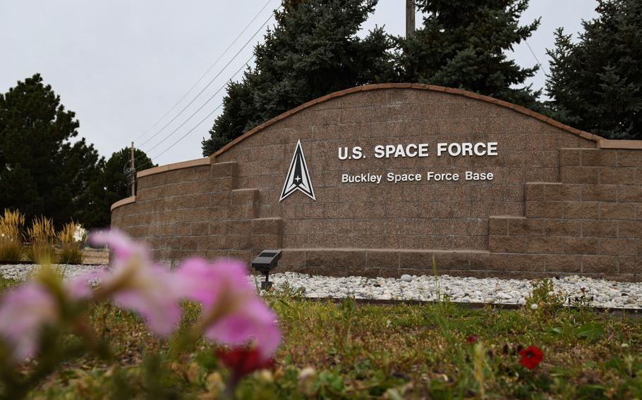 The Buckley Space Force Base sign on a stone wall.