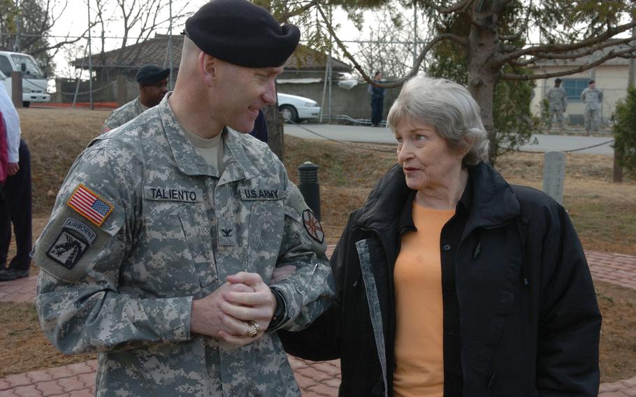 Betty Humphreys, widow of Chief Warrant Officer 2 Benjamin K. Humphreys, talks with 
Col. Michael J. Taliento Jr. while visiting Camp Humphreys in March 2007. 

 