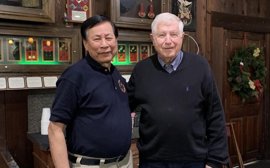 Hoang Ly, left, and Steve Greene reunited over lunch last year at a Virginia restaurant. They hadn’t seen each other in 20 years. 