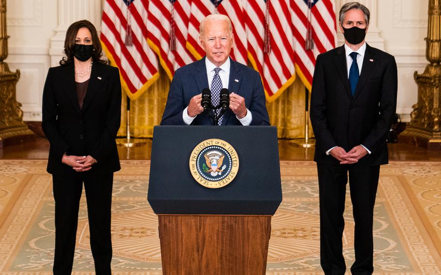 Joe Biden speaks about the evacuation of Afghanistan at the White House on Aug. 20, 2021, flanked by Vice President Kamala Harris, left, and Secretary of State Antony Blinken.