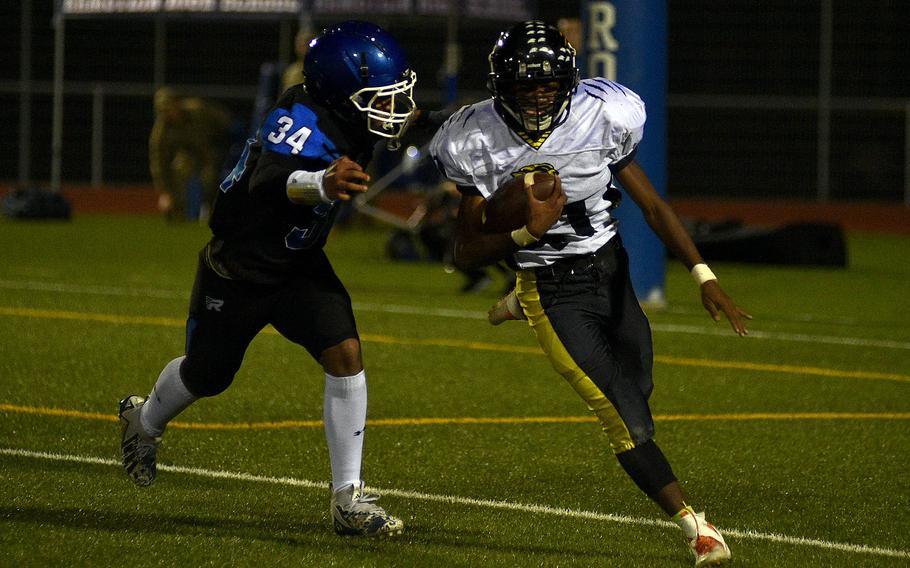 Elijah Morris dives for a tackle.