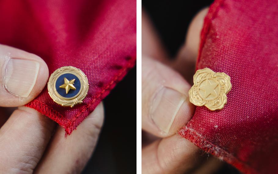 Andy Weiss displays two pins in this composite photo. At left is a Gold Star pin, distinctive with its purple background. At right is a Next of Kin pin. 