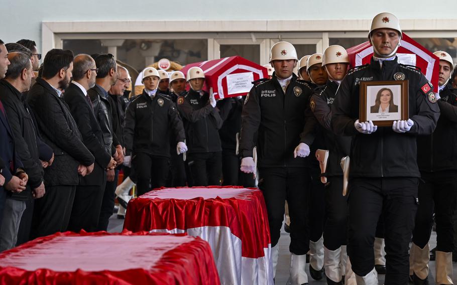 Turkish soldiers carry the coffins of workers killed in the attack on defense company TUSAS, Oct. 24, 2024.