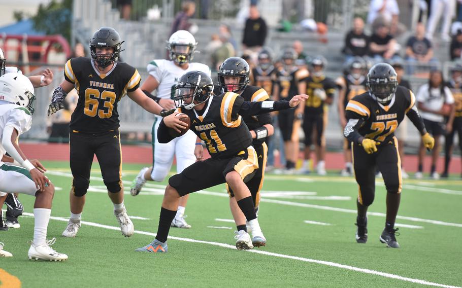 Vicenza quarterback Maxwell Thrash tries to juke Naples defenders Friday, Sept. 20, 2024, in the Cougars’ 28-6 loss to the Wildcats.