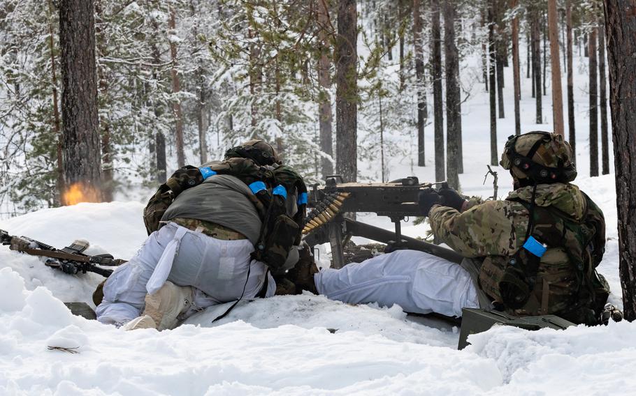 Soldiers shoot a mock machine gun