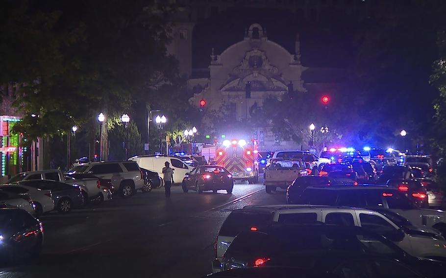 Police and emergency vehicles in the entertainment district after a shooting in Birmingham