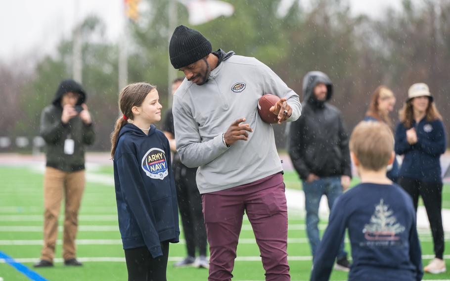 Local kids and caregivers from military and veteran families participate in the “USAA’s Heroes Huddle at the Army-Navy Game” with Robert Griffin III 