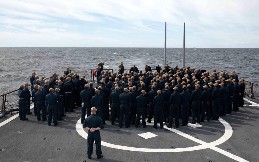 Sailors aboard the destroyer USS Arleigh Burke hold a memorial service for Seaman Recruit David “Dee” Spearman, who died after falling overboard on Aug. 1, 2022. A subsequent Navy investigation found that Spearman died in the line of duty and not as a result of misconduct.