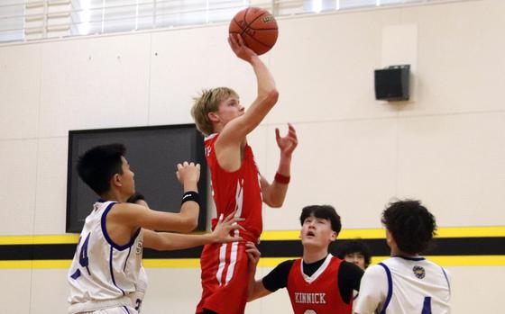 Kinnick's Gregor Tolar puts up a shot against St. Mary's.