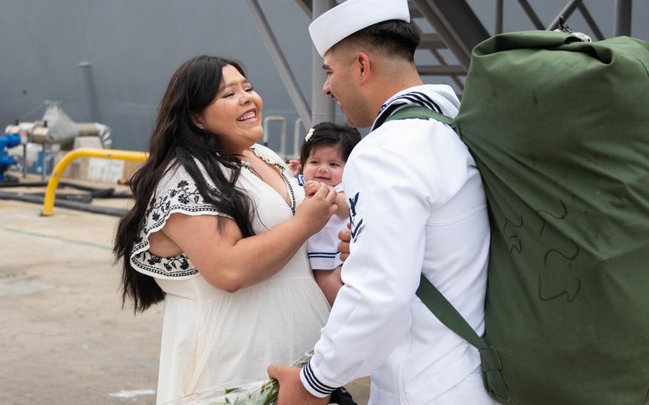 Retail Services Specialist 3rd Class Cesar Cardenas assigned to the Arleigh Burke-class guided-missile destroyer USS Halsey (DDG 97) reunites with his family during the ship’s homecoming at Naval Base San Diego, Aug. 16, 2024. 