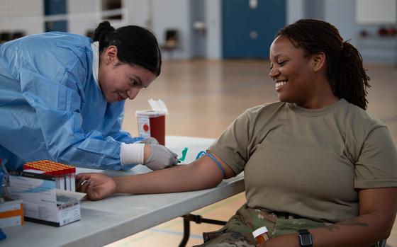 Members from the 52nd Healthcare Operations Squadron taking blood at the Saber Knight training exercise at Spangdahlem Air Base, Germany, May 10th, 2024. The simulated medical pod tested service members on their response time  and ability to perform their roles effectively. (U.S. Air Force photo by Airman 1st Class Jordan Gonzalez)