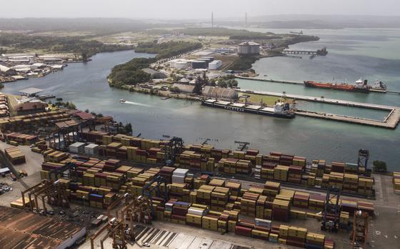 Stacks of cargo containers seen by a port.