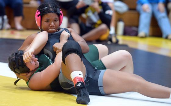 Kadena's Jasmine Kinney pins Kubasaki's Isabella Sangiorgi in 36 seconds at 180 pounds during Wednesday's historic first dual meet between DODEA-Pacific girls wrestling teams. The Panthers won the meet 39-6.