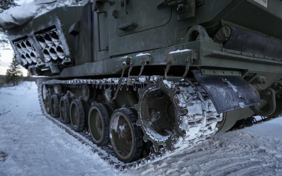 A U.S. Army MLRS leaves tracks in the snow.