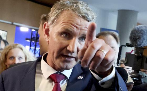 Bjoern Hoecke, top candidate in Thuringia of the far-right Alternative for Germany, gestures as he walks through the state parliament, in Erfurt, Germany, Sunday, Sept. 1, 2024.