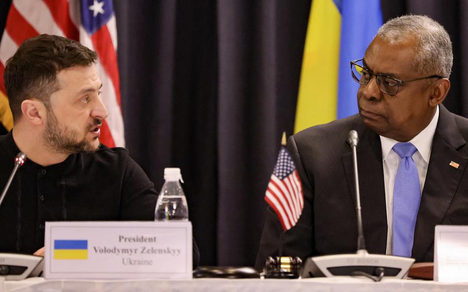 Ukraine’s President Volodymyr Zelensky, left, and U.S. Secretary of Defense Lloyd Austin, right.