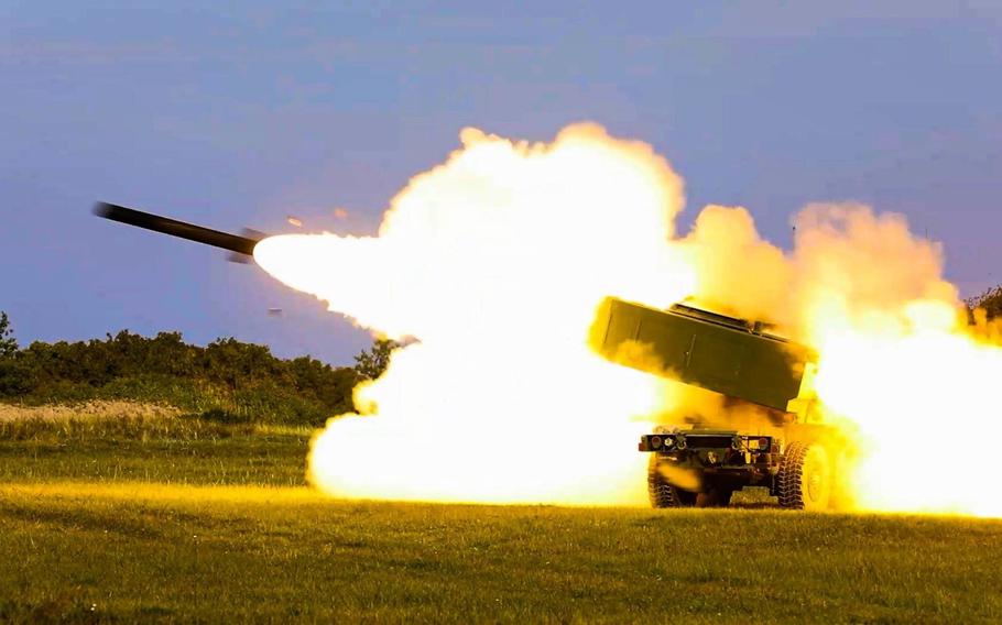 A High Mobility Artillery Rocket System fires during a military exercise in Latvia in September 2022. 