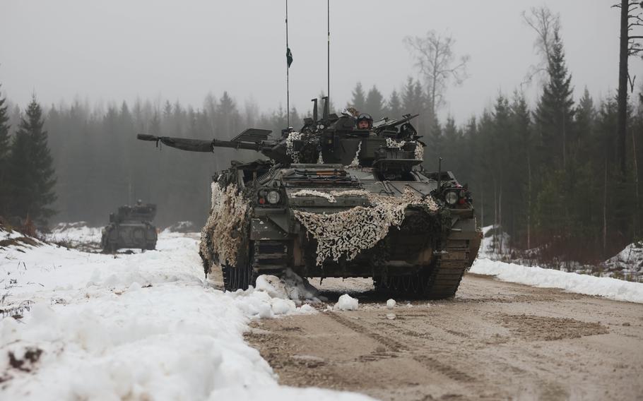 British forces patrol in a Warrior 510 combat vehicle.