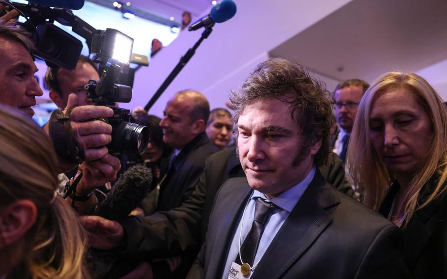 Javier Milei, Argentina’s president, center, and his sister, Karina Milei, right, in the Congress Center on Day 1 of the World Economic Forum in Davos, Switzerland, on Jan. 17. 