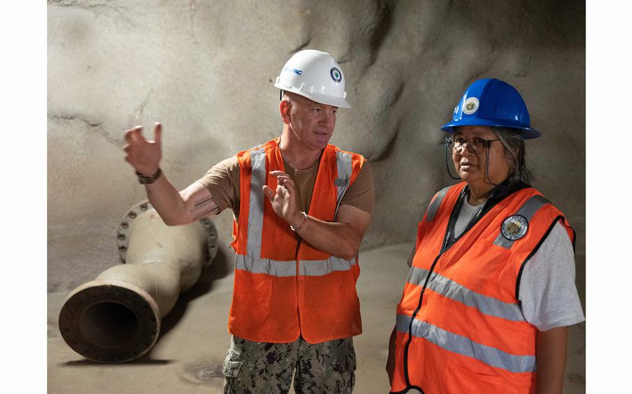 Joint Task Force-Red Hill response director, U.S. Navy Capt. Michael Obeirne, and a Hawaii Department of Health state on-scene coordinator review the Red Hill Bulk Fuel Storage Facility, Halawa, Hawaii, Oct. 10, 2023. 