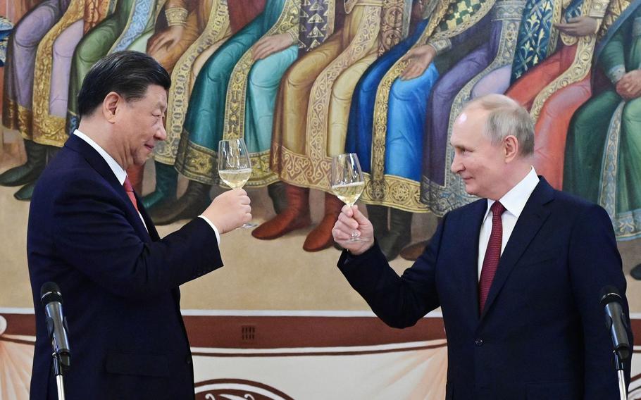 In this file photo, Russian President Vladimir Putin and China’s President Xi Jinping make a toast during a reception following their talks at the Kremlin in Moscow on March 21, 2023.