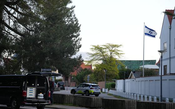 A police vehicle is seen near the Israeli embassy in Copenhagen, as police investigate two explosions near the site, on Wednesday, Oct. 2, 2024. (Emil Helms/Ritzau Scanpix via AP)