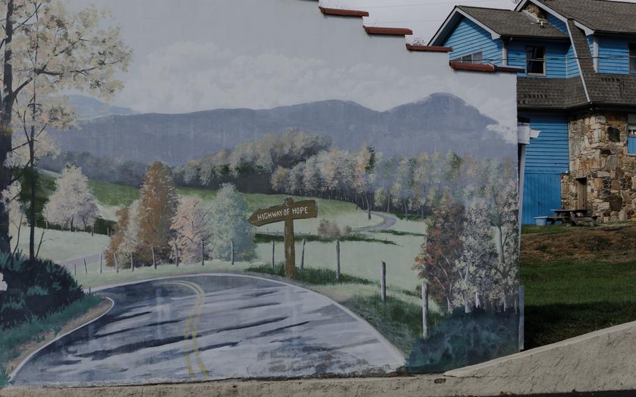 A mural in Burnsville, N.C., features a sign that says “Highway to Hope.” 