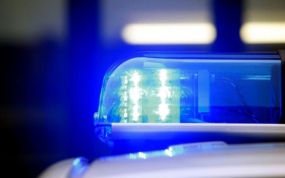 A light flashes on top of a police car.