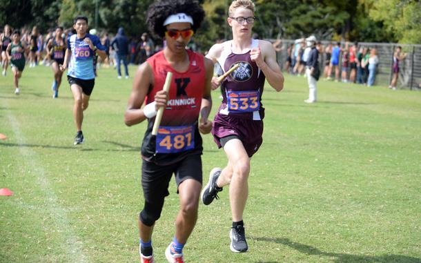 Kinnick's Samuel Montgomery (481) and Perry's Xavier Mitchell, the eventual Far East D-II relay race winner, navigate one of the course's straightaways.