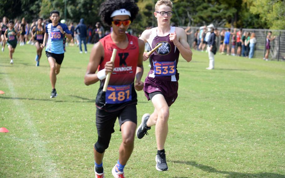 Samuel Montgomery and Xavier Mitchell run.