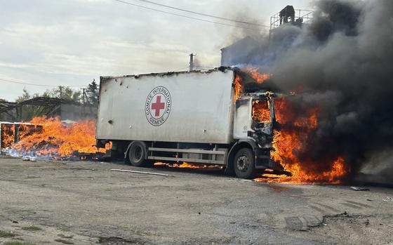 Image released by the Police of the Donetsk Region that shows a burning Red Cross vehicle that was destroyed in a Russian strike in the Donetsk region on Thursday Sept. 12, 2024. (Police of the Donetsk Region via AP)