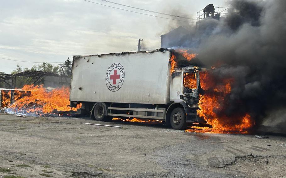 Burning Red Cross vehicle