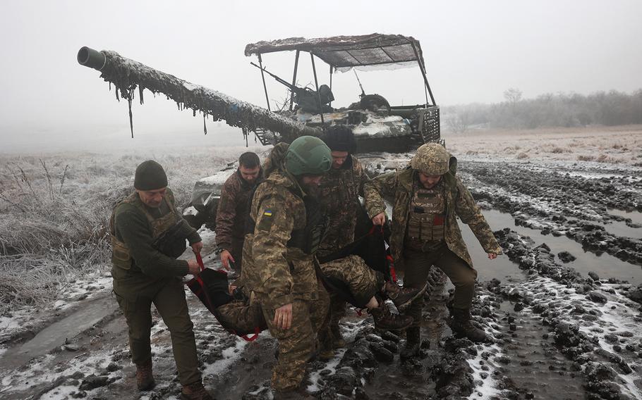 Ukrainian tank crews practice the evacuation of a comrade during a drill not far from the front line in the Bakhmut direction, in the Donetsk region, on Dec. 15, 2023, amid the Russian invasion of Ukraine.