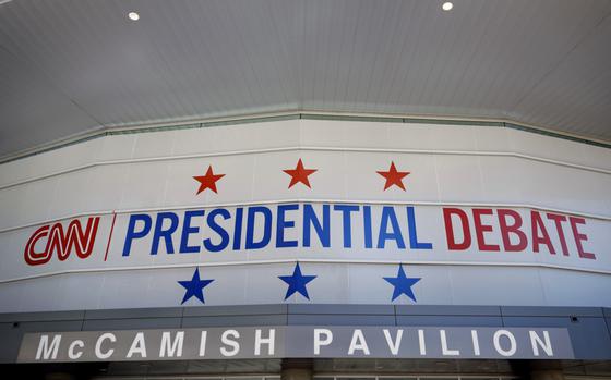 Signs advertising the CNN  presidential debate are seen on the McCamish Pavilion on the campus of Georgia Tech on June 25, 2024 in Atlanta, Georgia. U.S. President Joe Biden and Republican presidential candidate former President Donald Trump will face off in the first presidential debate of the 2024 presidential cycle this Thursday. (Kevin Dietsch/Getty Images/TNS)