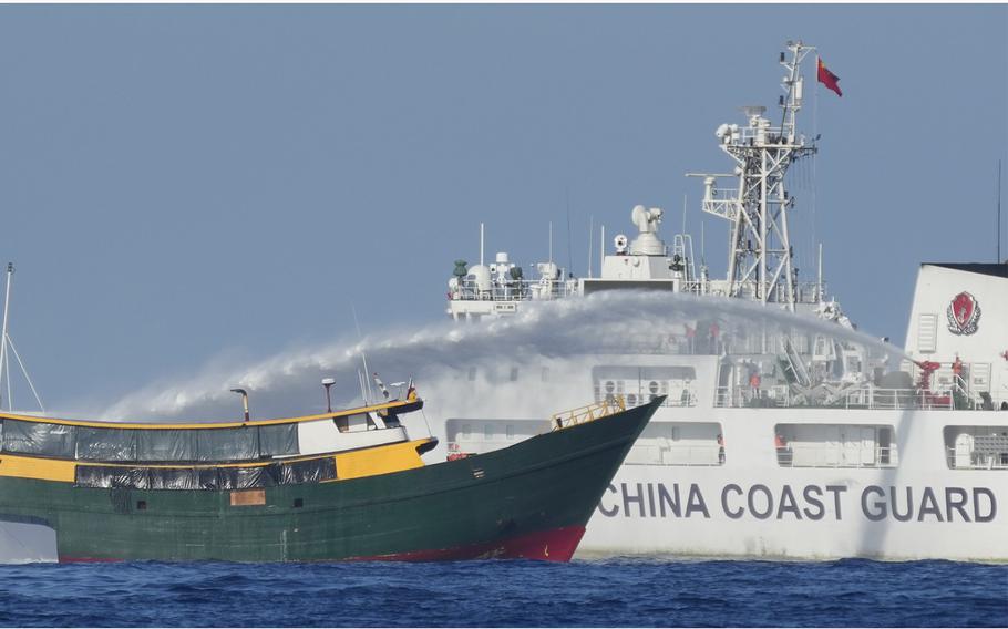 A Chinese coast guard ship fires a water cannon at Philippine vessel Unaizah on May 4, 2024, near the Second Thomas Shoal in the disputed South China Sea.