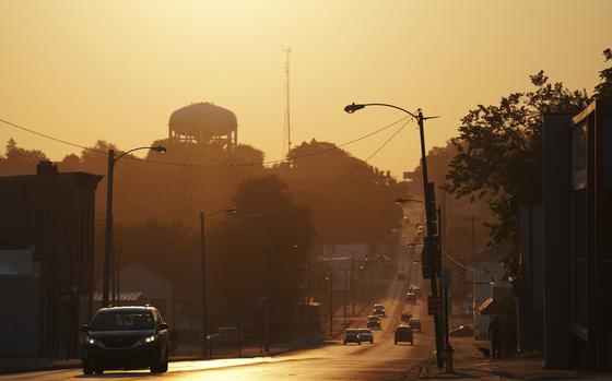 The sun rises over the city of Springfield, Ohio, Monday, Sept. 16, 2024. (AP Photo/Jessie Wardarski)