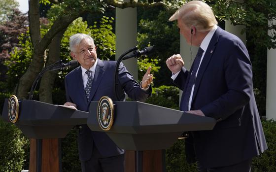 FILE - Mexico's President Andres Manuel Lopez Obrador, left, and President Donald Trump give a news conference before signing a joint declaration at the White House in Washington, July 8, 2020. Mexico’s president called Trump “a friend” Friday, July 19, 2024, and said he will write the former U.S. president a letter the next week to warn him against closing the border or blaming migrants for bringing drugs into the U.S. (AP Photo/Evan Vucci, File)