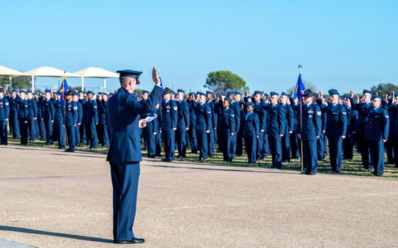 Airmen take the enlistment oath at the end of basic training at Joint Base San Antonio-Lackland, Texas on Dec. 19, 2024. Military mental health figures show adjustment disorder has increased among service members and is more prevalent among those with three years of service or less. 