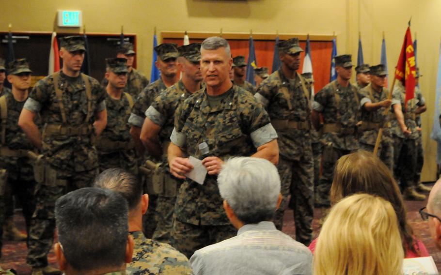 Brig. Gen. Kevin Collins, the 3rd Marine Logistics Group's new commander, speaks during his change-of-command ceremony at Camp Kinser, Okinawa, Thursday, Aug. 29, 2024.