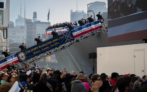 U.S. Navy Sailors with the Arleigh Burke-class guided-missile destroyer USS John Basilone (DDG 122) participate in the commissioning ceremony of John Basilone in New York City, New York, Nov. 9, 2024. The crew will alsobe participating in Veterans Day events. This is the second Naval warship to bear the name of John Basilone. (U.S. Marine Corps photo by Cpl. Alexis French)