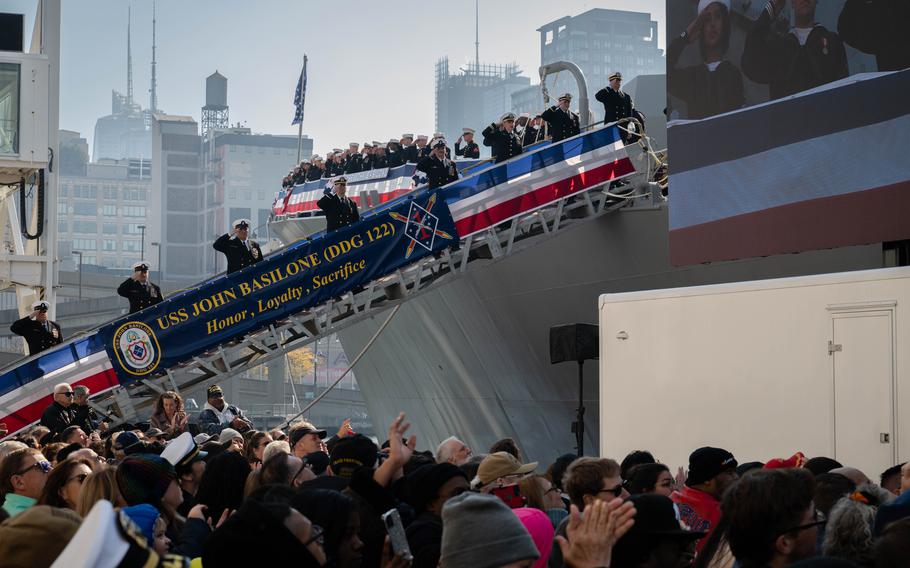 U.S. Navy Sailors participate in a commissioning ceremony.