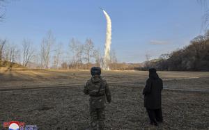 In this photo provided by the North Korean government, its leader Kim Jong Un, right, inspects testing of sea-to-surface strategic cruise guided weapons at an undisclosed location in North Korea, Saturday, Jan. 25, 2025. Independent journalists were not given access to cover the event depicted in this image distributed by the North Korean government. The content of this image is as provided and cannot be independently verified. Korean language watermark on image as provided by source reads: "KCNA" which is the abbreviation for Korean Central News Agency. (Korean Central News Agency/Korea News Service via AP)