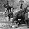 Somewhere in the mountains, South Korea, Jan. 5, 1962: Privates First Class Robert Andalis (front) and John Barnes of A Company, 2nd Battle Group, 12th Cavalry Regiment check and defuse landmines found on the road. 

The men of the 12th Cavalry Regiment participated in a month-long Army training test. The training, which began Jan. 2, is held in the mountain areas of South Korea where the cavalrymen honed their skills in varied terrains such as jungles and expansive open agricultural paddies. Part of the combat exercise was devoted to learning to spot and defuse so-called boobytraps - often hidden anti-personnel mines. 

Looking for Stars and Stripes’ historic coverage? Subscribe to Stars and Stripes’ historic newspaper archive! We have digitized our 1948-1999 European and Pacific editions, as well as several of our WWII editions and made them available online through https://starsandstripes.newspaperarchive.com/

META TAGS: 12th Cavalry Regiment; 1st Cavalry Division; U.S. Army; boobytrap; booby trap; IED; improvised explosive device; mine; anti-personnel mine