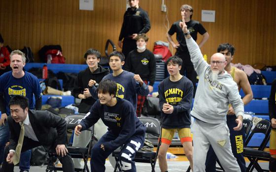 St. Mary's and coaches celebrate as they capture the Far East Division I dual-meet team title.