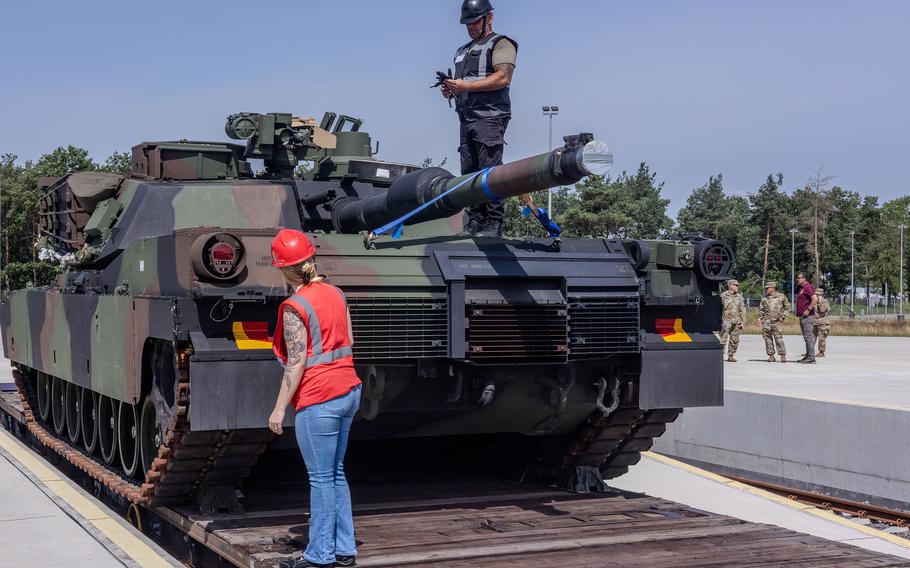 Sarah Floyd and the production control team inspect an M1 Abrams tank after its arrival at the Powidz Army Prepositioned Stock-2 Worksite in Powidz, Poland, on June 27, 2024. The APS-2 site received the standard makeup of a U.S. Army armored brigade combat team. 